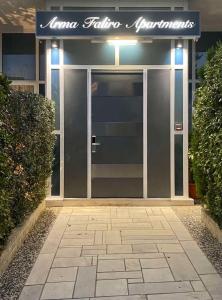 an entrance to a building with a glass door at Arma Faliro Apartments in Athens