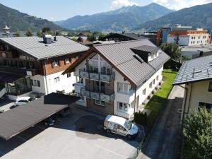 an aerial view of a town with houses and a van at Fourteen Zell am See S&P by All in One Apartments in Zell am See
