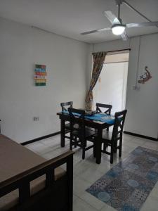 a dining room with a table and chairs at Departamento Centro in La Rioja +12 photos