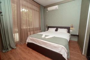 A bed or beds in a room at Villa Lapa