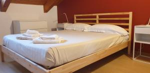 Säng eller sängar i ett rum på Appartamento Residenza Lavinia