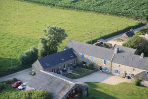 an aerial view of a house in a field at La Clé des Champs des Abers in Saint-Pabu