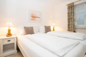 Ένα ή περισσότερα κρεβάτια σε δωμάτιο στο Appartement Wattschnecke