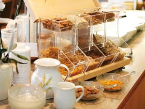 a buffet with a bunch of food on a counter at Hotel Gabriel in Keutschach am See
