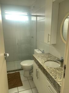Ванная комната в Apartamento Praia de Pajucara
