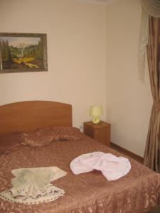 Postel nebo postele na pokoji v ubytování Vian Guest House