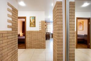 a hallway with a brick wall in a house at City Center. Luxury. Marine Academy. in Kherson