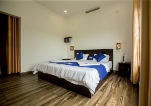 Postelja oz. postelje v sobi nastanitve White Stone Vagamon Hilltop Cottage by VOYE HOMES