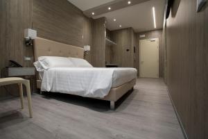 Postel nebo postele na pokoji v ubytování Hotel Tre Ville