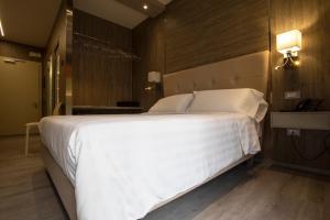Postel nebo postele na pokoji v ubytování Hotel Tre Ville