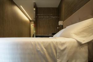 Postel nebo postele na pokoji v ubytování Hotel Tre Ville