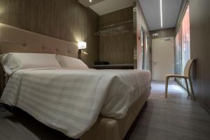 Postel nebo postele na pokoji v ubytování Hotel Tre Ville