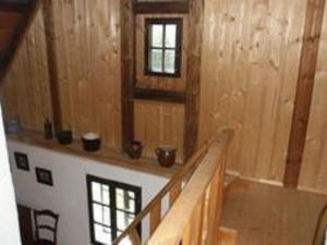 a room with a staircase in a wooden house at Holiday Home in Nejdek in West Bohemia with garden in Nejdek