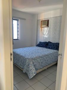 Кровать или кровати в номере Apartamento Praia de Pajucara