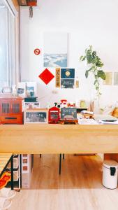 a desk with a bunch of items on it at 綠色的日子 in Nantou City