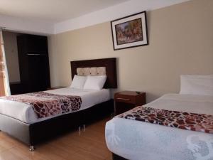 Hotel Mantas Cusco客房内的一张或多张床位