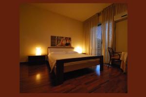 A bed or beds in a room at Nuovo Mondo