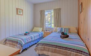 Postel nebo postele na pokoji v ubytování Anson Bay Lodge