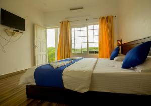 Postelja oz. postelje v sobi nastanitve White Stone Vagamon Hilltop Cottage by VOYE HOMES