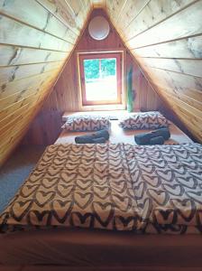 Un pat sau paturi într-o cameră la Chata Xa-Inu