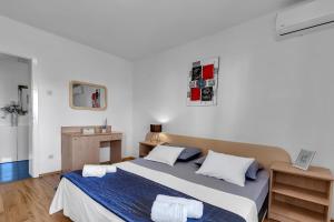 Posteľ alebo postele v izbe v ubytovaní Apartment Ivo Makarska