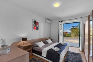 Posteľ alebo postele v izbe v ubytovaní Apartment Ivo Makarska
