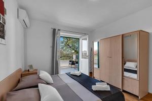 Posteľ alebo postele v izbe v ubytovaní Apartment Ivo Makarska