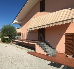 a building with a staircase on the side of it at Tuscan Dream Casa Vacanze in Pieve a Nievole