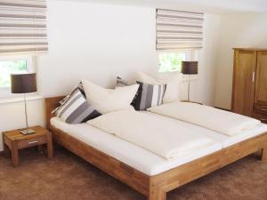 Postel nebo postele na pokoji v ubytování Waldhusen Apartments - Adults Only