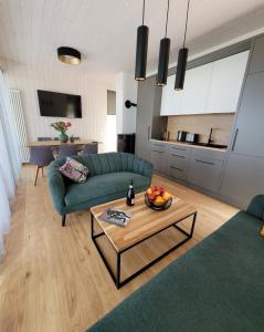 a living room with a couch and a table at Beach House Trimpas 