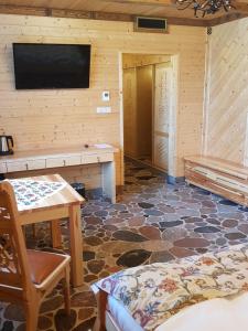 Televízia a/alebo spoločenská miestnosť v ubytovaní Chata Góralska i Pokoje Gościnne