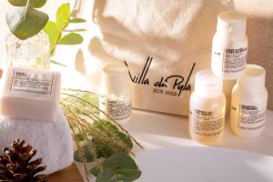 a table with several bottles of moisturizing products on it at Villa du Pyla in Pyla-sur-Mer