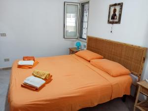 A bed or beds in a room at Casa Sole e Mare indipendente a Triscina