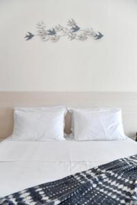 מיטה או מיטות בחדר ב-Sandaya Living - M Apartment