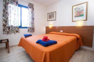 Postel nebo postele na pokoji v ubytování Villas Las Marinas + 24 fotografií