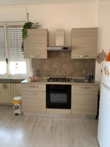 Kuhinja oz. manjša kuhinja v nastanitvi "L'Armonia" Apartment