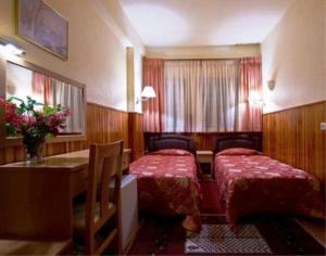 Voodi või voodid majutusasutuse Hotel Bitouni toas