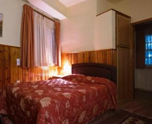 Voodi või voodid majutusasutuse Hotel Bitouni toas
