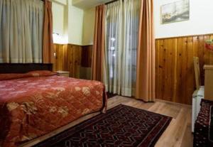 Voodi või voodid majutusasutuse Hotel Bitouni toas