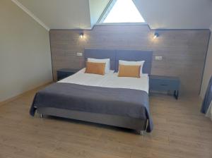 Кровать или кровати в номере Парк Хаджох