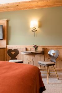 Sjónvarps- og/eða afþreyingartæki á Superior Hotel Tirolerhof - Zell am See