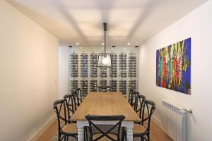 a dining room with a table and chairs at FLH Serralves House with Garden in Porto