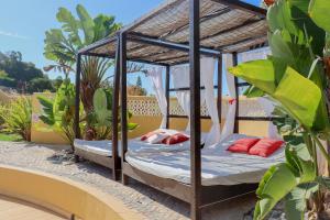 a bed in a gazebo on a balcony at Quinta Nova Vale Del Rey in Carvoeiro