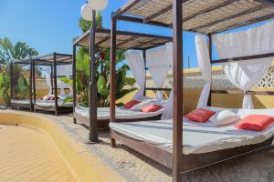 a group of four bunk beds on a patio at Quinta Nova Vale Del Rey in Carvoeiro