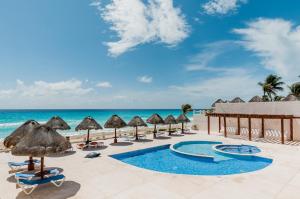 a view of a resort with chairs and umbrellas at HotelZone L20 Beach Access in Cancún