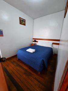 Cama o camas de una habitación en Sumayaq Hostel Cusco