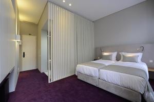 Cama ou camas em um quarto em EMAJ Boutique Hotel