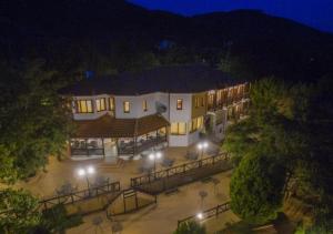 an aerial view of a hotel at night at Roxani Country House Resort in Maronia +24 photos