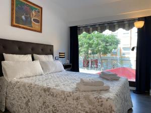 Ένα ή περισσότερα κρεβάτια σε δωμάτιο στο LC Apartamentos César Augusto