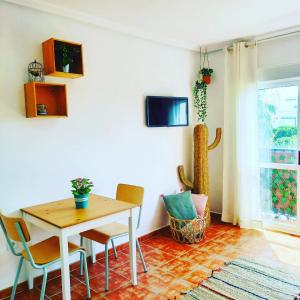 a dining room with a table and chairs at Agua Amarga Design in Agua Amarga